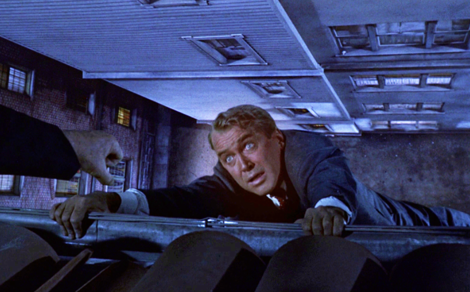 Scottie almost falls from a rooftop in his memory